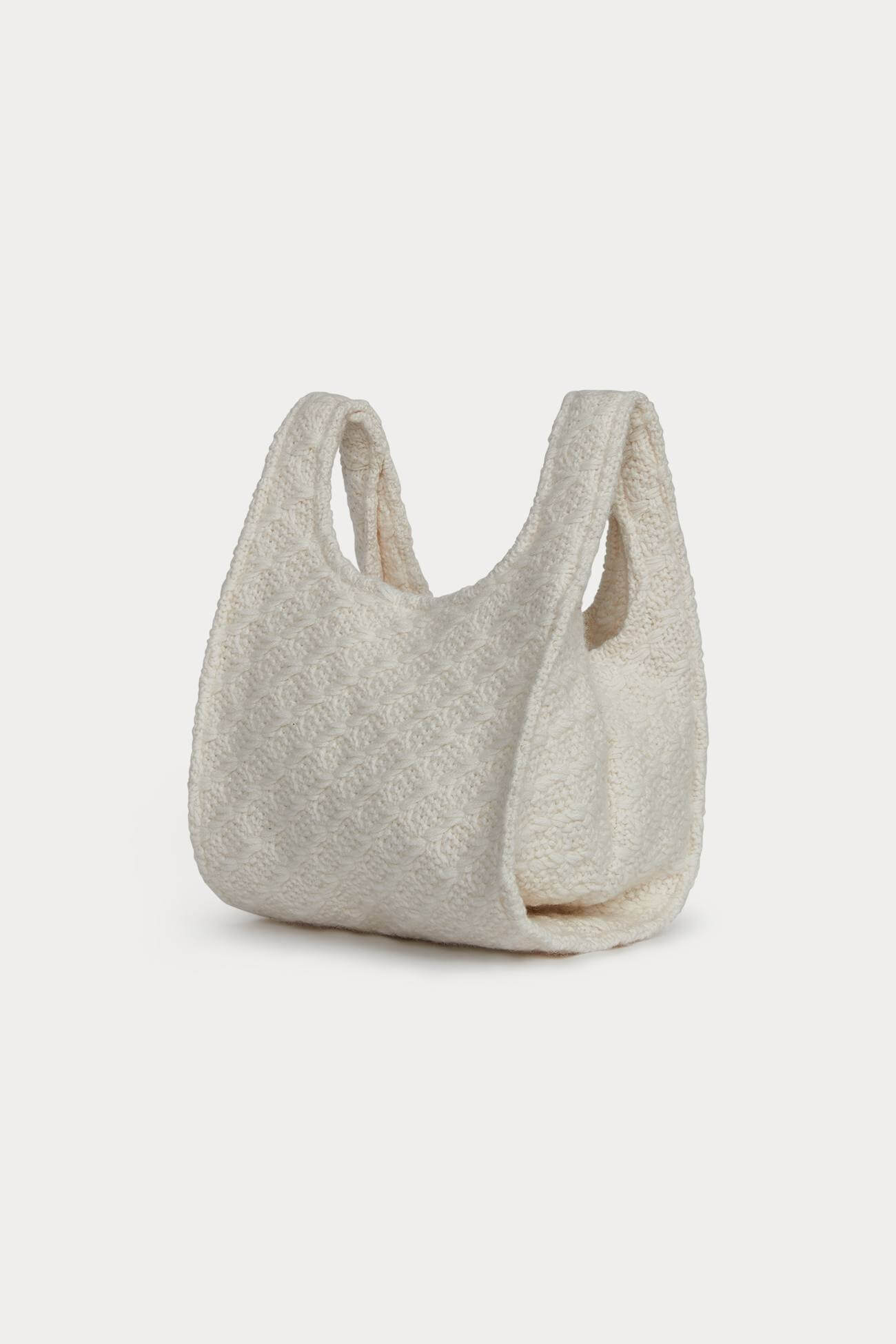 Cream textured bag from the Accessories collection perfect for stylish outings.